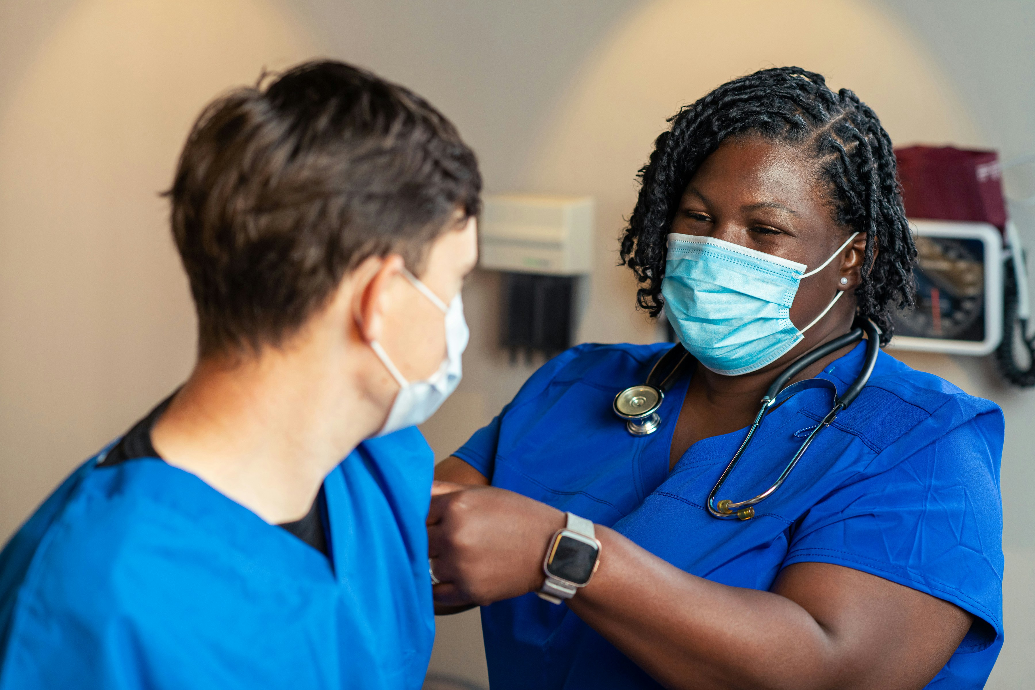 Healthcare professional preparing for a clinical role